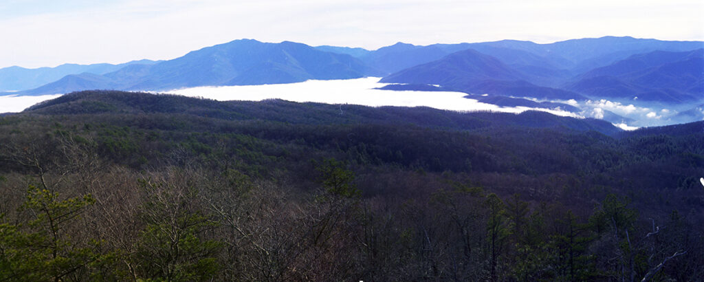 Thermal inversion, 55° on the peaks and 40° in the valley, looking toward Mount Le Conte, December 1974 (Panoramic Images of Elgin P. Kintner, UT Libraries)