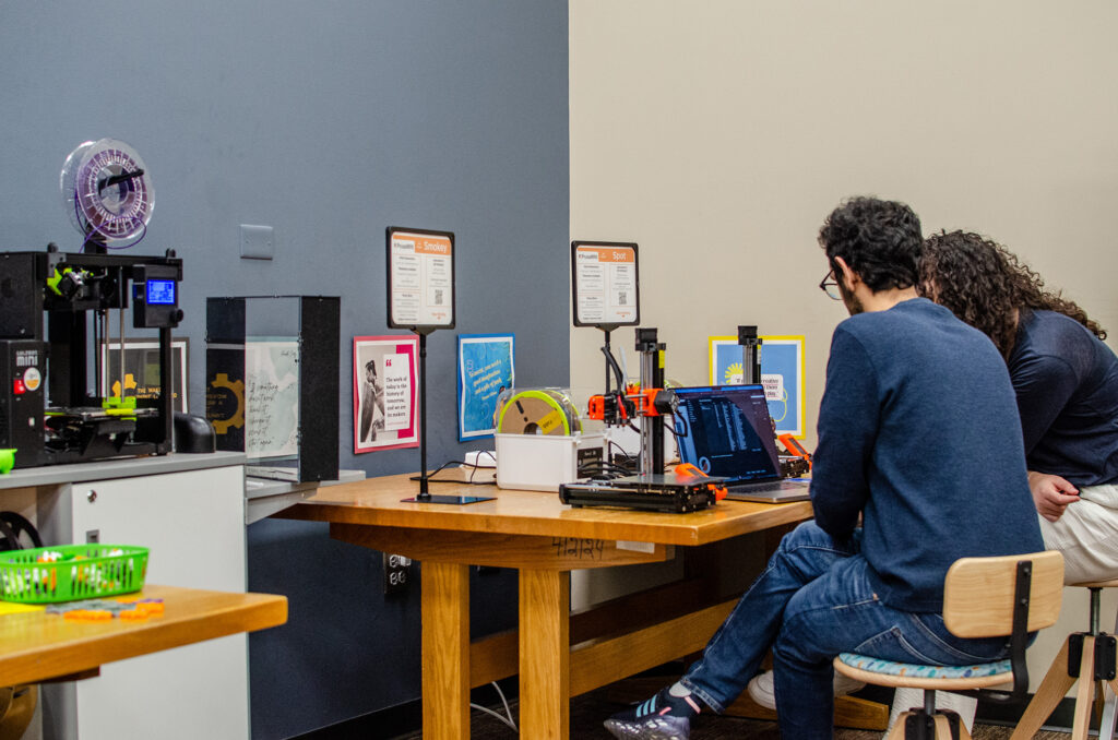 Medbery Makerspace, 209 Hodges Library--a staff member assists a user