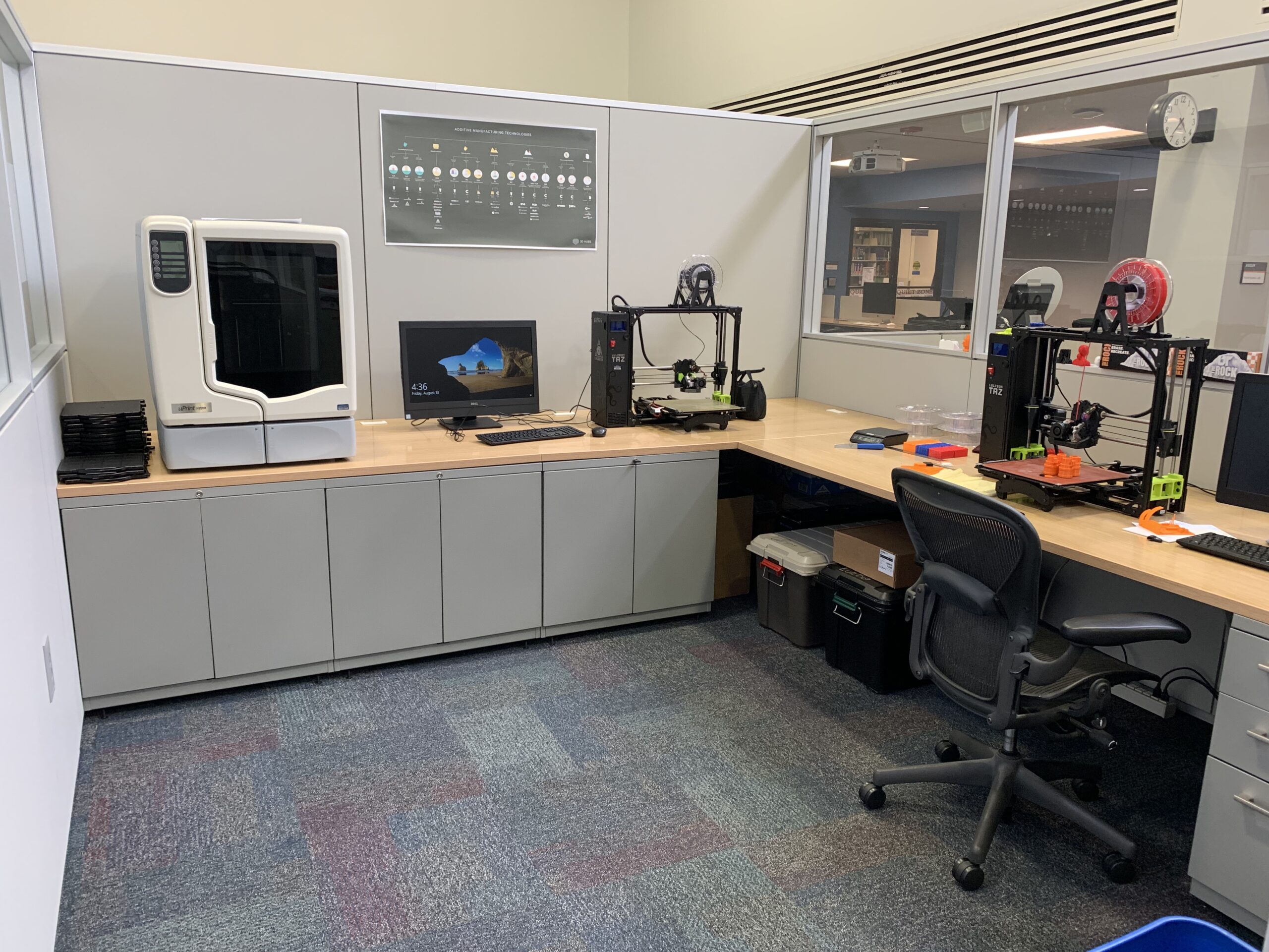 Makerspace area in Pendergrass Library. On the left there is the uPrint professional grade 3D printer. To the right, there are two Taz Lulzbot 6 printers.